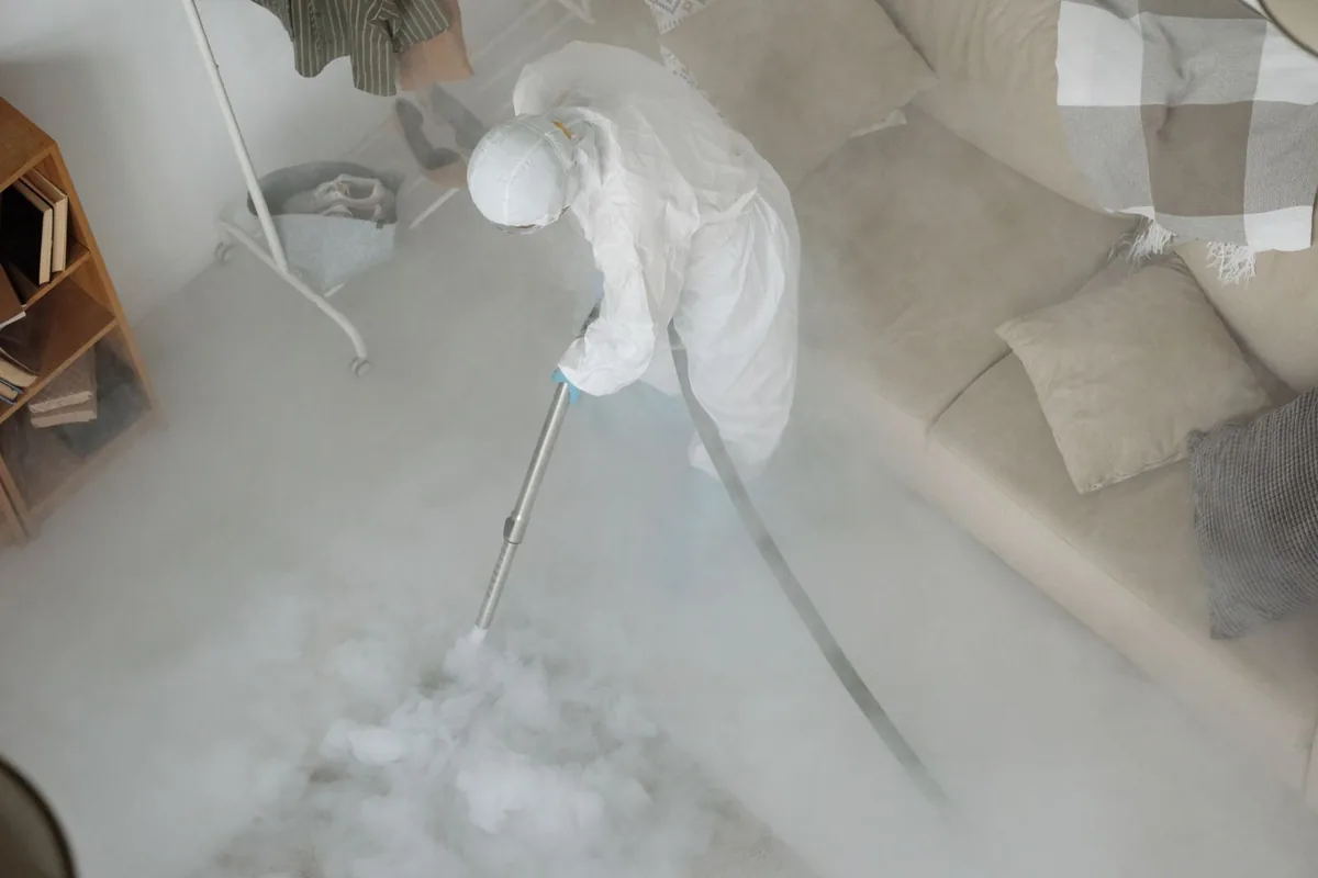 Biohazard cleanup technician in protective equipment, Crocker Highland, Oakland, CA